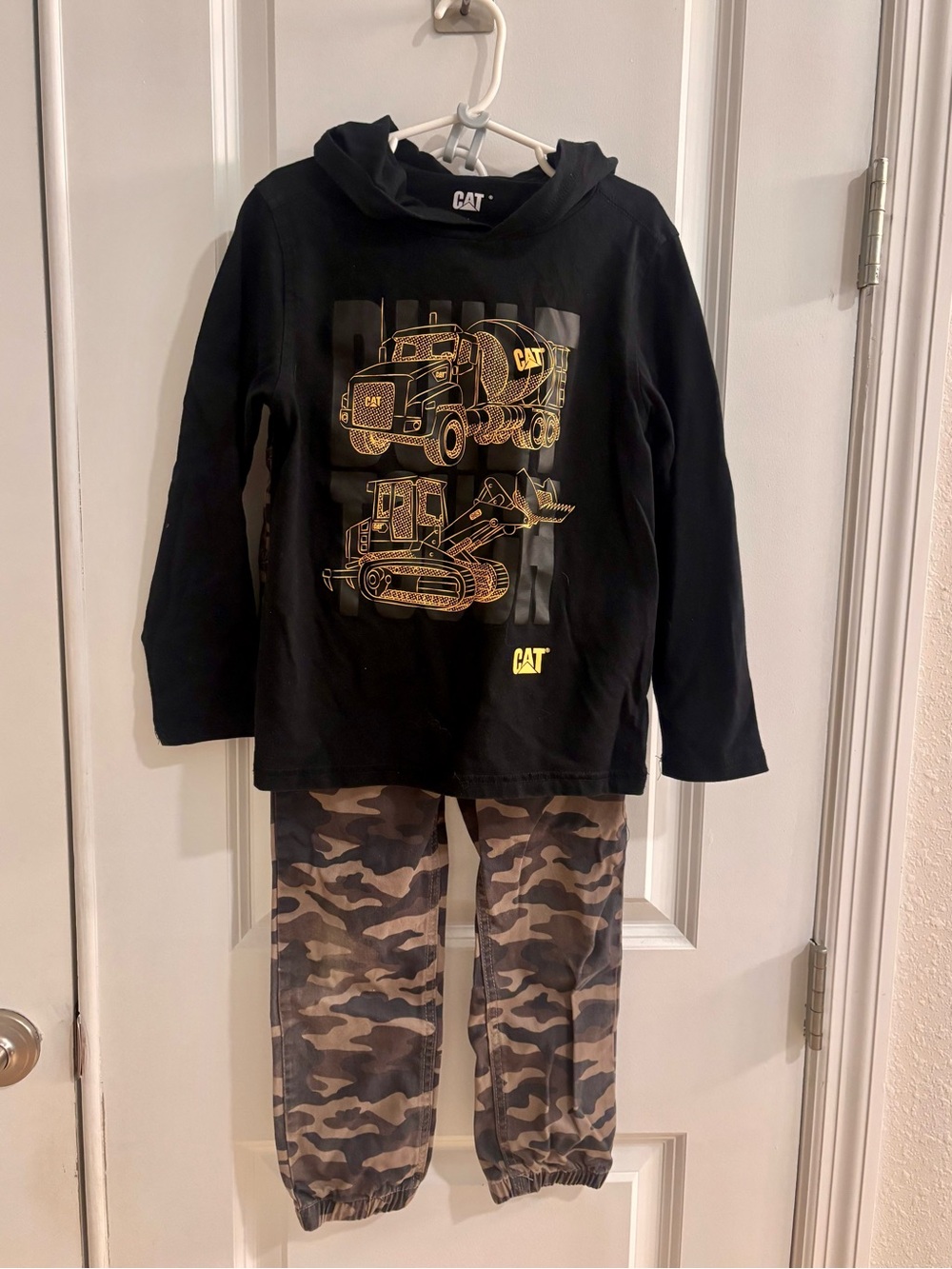 Caterpillar Black Top Hoodie with Yellow Construction Graphics and Camo Pants